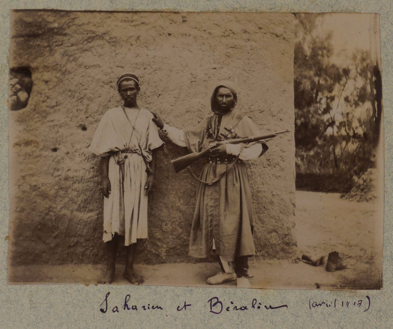 Item #257 [Collection of Two Albums with 128 Original Gelatin Silver Photos Taken by a French Participant of the South-Oranese Campaign in Southwestern Algeria, Showing Towns and Military Posts (Taghit, Béni Abbès, Mazzer, Igli, Kerzaz, Tamtert, Béni Ounif, Duveyrier, Ain Sefra, Saida), Native Ksars, Military Convoys, Wounded French Military Men, Funeral and Exhumation of French Officers, Captured Berbers, Hermitage of a Catholic Hermit Charles de Foucauld, Scenes of Vaccination by Dr. Perrin, Portraits of the Local People, etc.]. MIDDLE EAST, ISLAMIC WORLD - ALGERIA.
