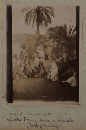 [Collection of Two Albums with 128 Original Gelatin Silver Photos Taken by a French Participant of the South-Oranese Campaign in Southwestern Algeria, Showing Towns and Military Posts (Taghit, Béni Abbès, Mazzer, Igli, Kerzaz, Tamtert, Béni Ounif, Duveyrier, Ain Sefra, Saida), Native Ksars, Military Convoys, Wounded French Military Men, Funeral and Exhumation of French Officers, Captured Berbers, Hermitage of a Catholic Hermit Charles de Foucauld, Scenes of Vaccination by Dr. Perrin, Portraits of the Local People, etc.]