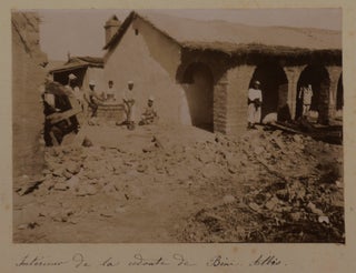 [Collection of Two Albums with 128 Original Gelatin Silver Photos Taken by a French Participant of the South-Oranese Campaign in Southwestern Algeria, Showing Towns and Military Posts (Taghit, Béni Abbès, Mazzer, Igli, Kerzaz, Tamtert, Béni Ounif, Duveyrier, Ain Sefra, Saida), Native Ksars, Military Convoys, Wounded French Military Men, Funeral and Exhumation of French Officers, Captured Berbers, Hermitage of a Catholic Hermit Charles de Foucauld, Scenes of Vaccination by Dr. Perrin, Portraits of the Local People, etc.]