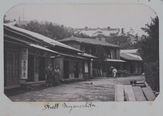 [Attractive Lacquered Album with 112 Original Photographs of Japan, China, Singapore, Samoa, and Hawaii, Including Interesting Images of Nikko Temples and Processions, Tea Houses, Villages and Hotels around Lake Hakone, Streets of Tokyo, and Nara, Panoramas of Penang and Hong Kong, Scenes of Execution in Canton, Portraits of “Maoris” and Samoans, etc., Titled]: Around the World, 1900.