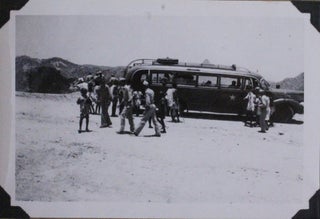 [Album with 196 Original Gelatin Silver Photos of Ghana (Accra, Aburi) and Eritrea (Asmara, Massawa, Cheren) Taken by a U.S. Air Force Serviceman in the Last Years of WWII, with Interesting Photos Including a “Witch Doctor Scaring away Evil Spirits After a Death of a Native,” G. I.’s Sharing Cigarettes with the Crowd of Locals, Native Women Shopping in their Traditional Attire, Soldiers “Getting Shoes Shined” by the Local Children & Holding Burst Shells on the Cheren Battlefield, etc.; also with the Photos of Military Installations, the Church of Our Lady of Rosary, the Asmara Cinema, Red Cross & Grand Hotels, etc.]